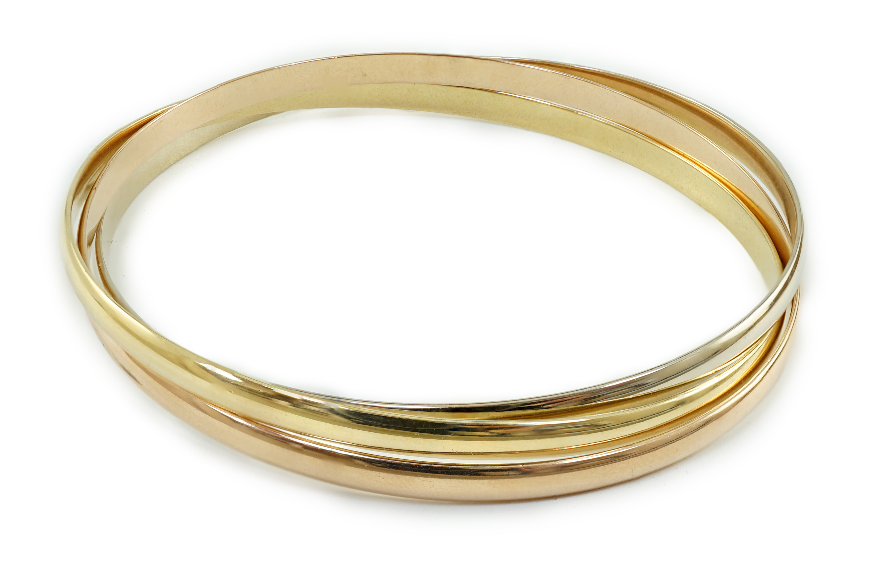 A modern three colour 18ct gold Cartier Russian triple bangle